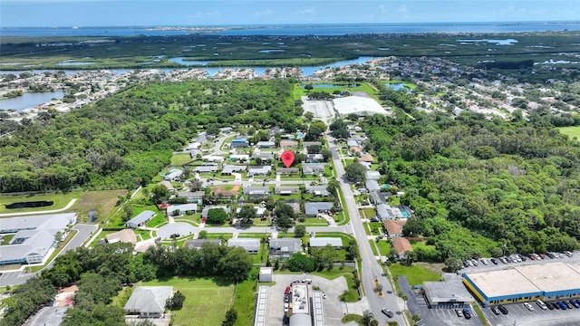 drone / aerial view with a water view and a residential view