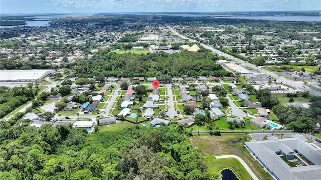 birds eye view of property with a water view and a residential view