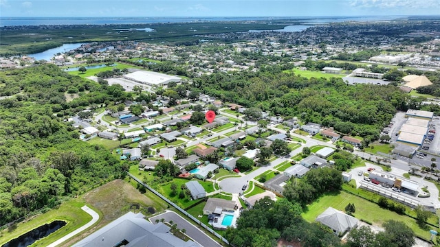 birds eye view of property with a residential view and a water view