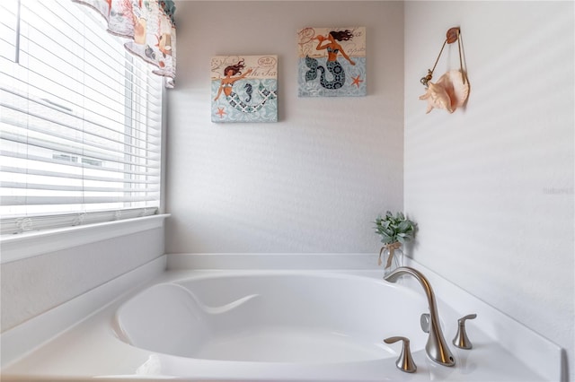 bathroom featuring a tub