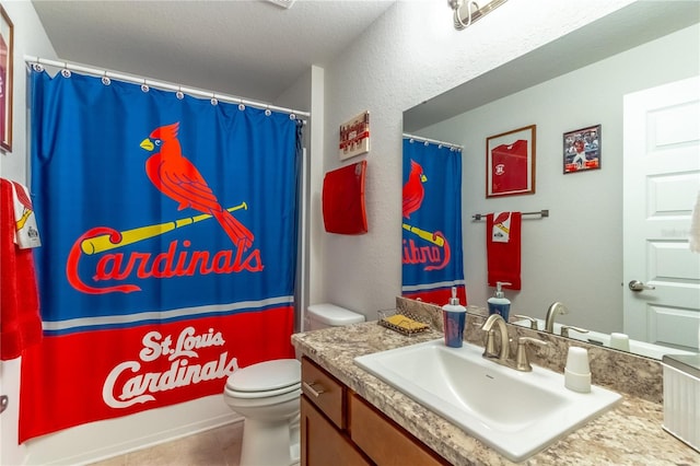 bathroom with tile patterned flooring, a textured ceiling, toilet, vanity, and curtained shower