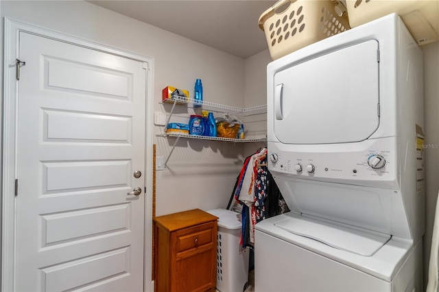 laundry area featuring stacked washing maching and dryer