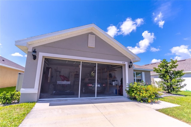 rear view of house featuring a garage