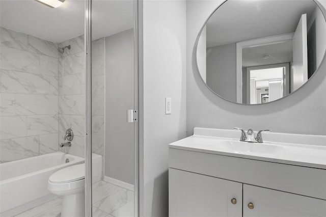 full bathroom with vanity, toilet, and tiled shower / bath