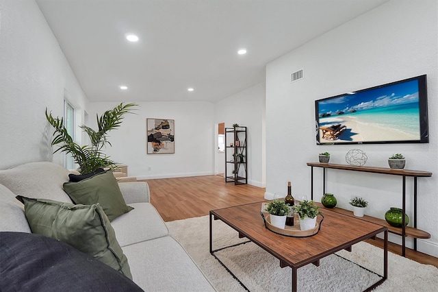 living room with light hardwood / wood-style flooring