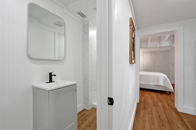 bathroom featuring hardwood / wood-style floors and vanity