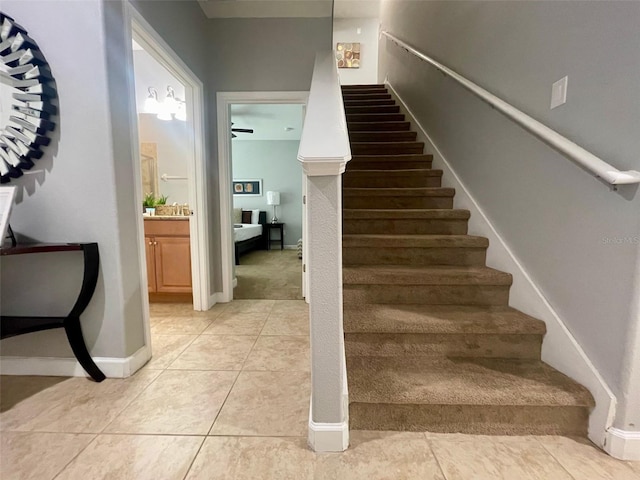 stairway with tile patterned floors