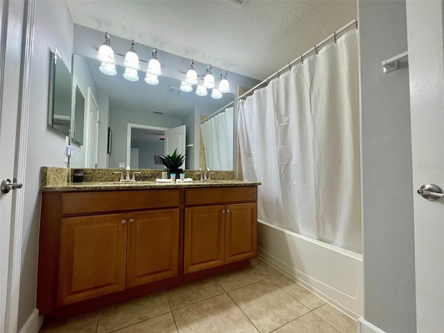 bathroom featuring shower / bath combination with curtain, tile patterned flooring, a textured ceiling, and vanity