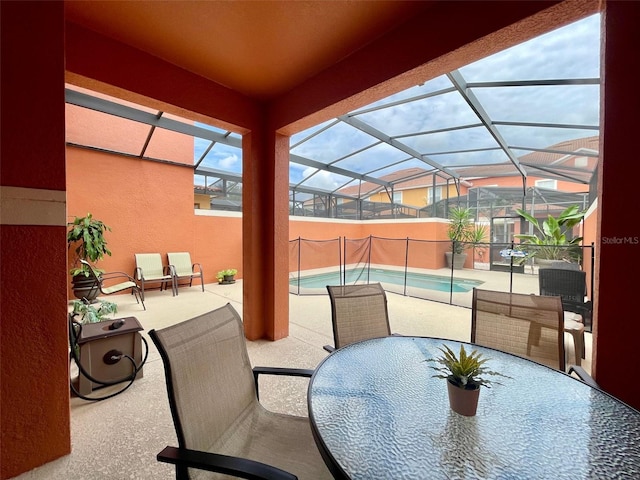 view of patio featuring a lanai