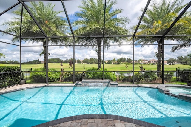 view of swimming pool featuring glass enclosure and an in ground hot tub