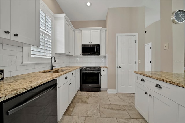 kitchen with white cabinets, dishwasher, light stone counters, sink, and range with electric stovetop