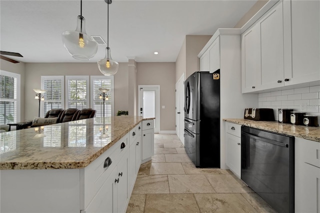 kitchen featuring white cabinets, ceiling fan, black refrigerator, and stainless steel dishwasher