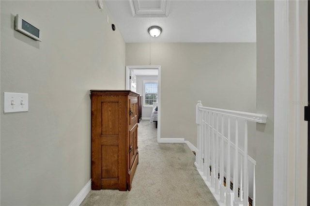 hallway with light colored carpet