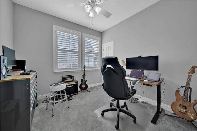 office area featuring light carpet and ceiling fan