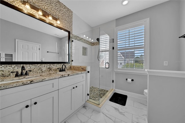 bathroom featuring vanity, toilet, an enclosed shower, and backsplash