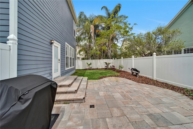 view of patio with a grill