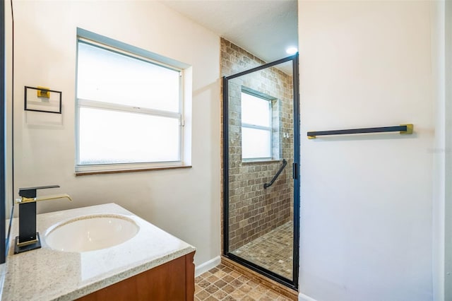 bathroom featuring vanity and a shower with shower door