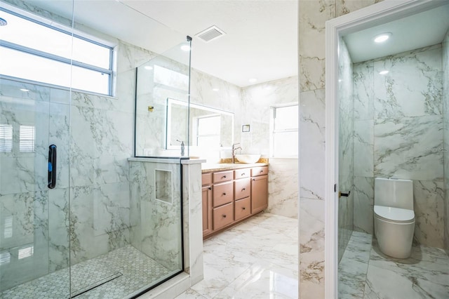 bathroom with vanity, toilet, walk in shower, and tile walls