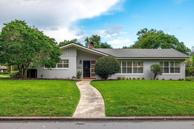 ranch-style house with a front lawn