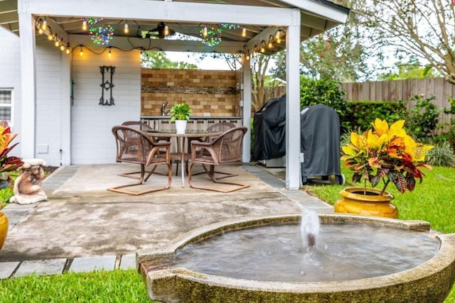 view of patio with a gazebo and a grill