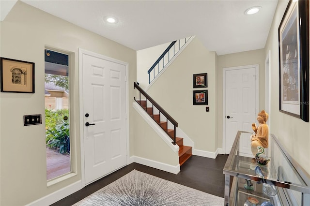 entryway with dark wood-type flooring