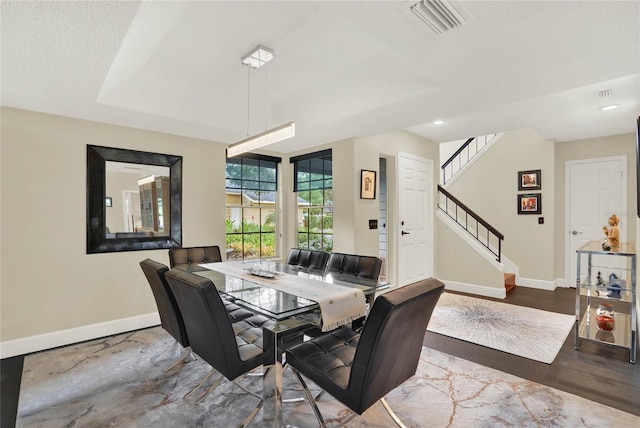 dining room with hardwood / wood-style floors