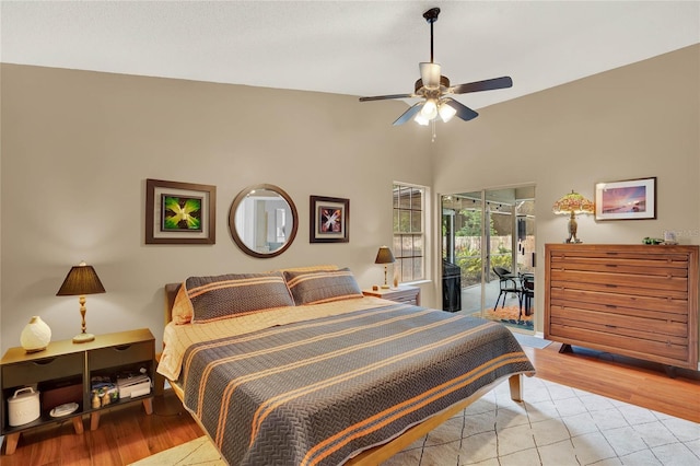 bedroom with light hardwood / wood-style flooring, ceiling fan, and access to outside