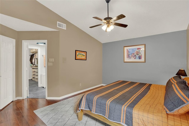 bedroom featuring vaulted ceiling, ceiling fan, and hardwood / wood-style floors