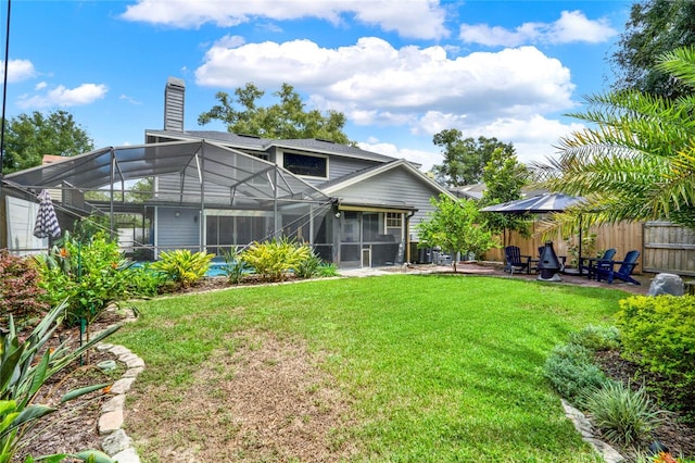 view of yard featuring a lanai and a patio