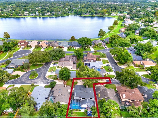 birds eye view of property with a water view