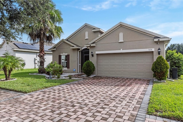 view of front facade with a garage and a front yard