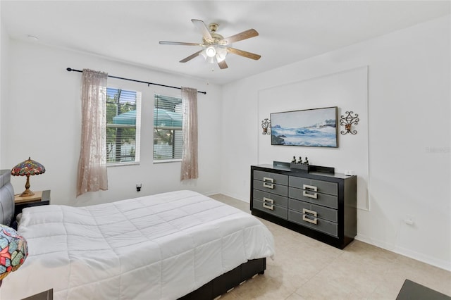 bedroom with light tile patterned floors and ceiling fan