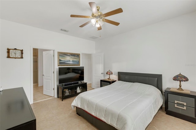 tiled bedroom with ceiling fan