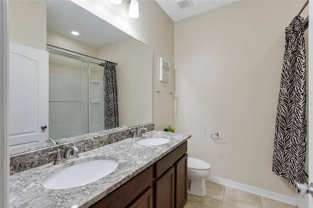 bathroom with tile patterned flooring, vanity, toilet, and an enclosed shower