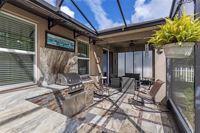 exterior space featuring an outdoor living space, area for grilling, and ceiling fan