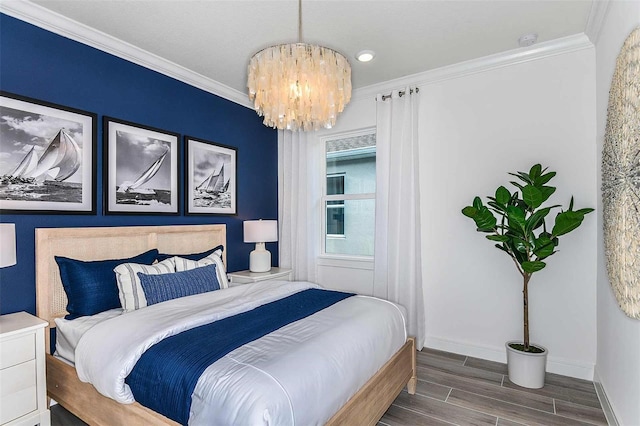 bedroom featuring ornamental molding, dark hardwood / wood-style floors, and a notable chandelier