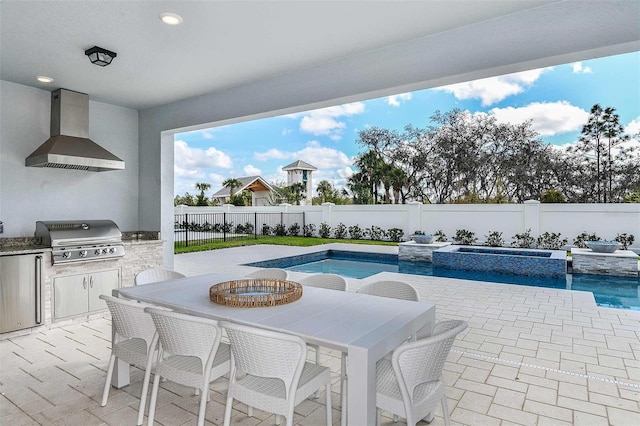 view of swimming pool featuring grilling area and a patio