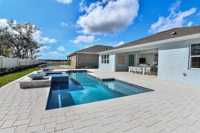 view of pool featuring an in ground hot tub and a patio area