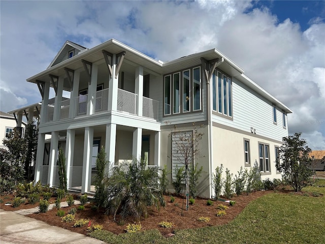 view of property exterior featuring covered porch