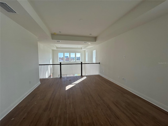 empty room featuring dark wood-type flooring