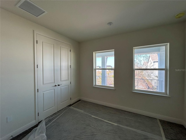 unfurnished bedroom with a closet