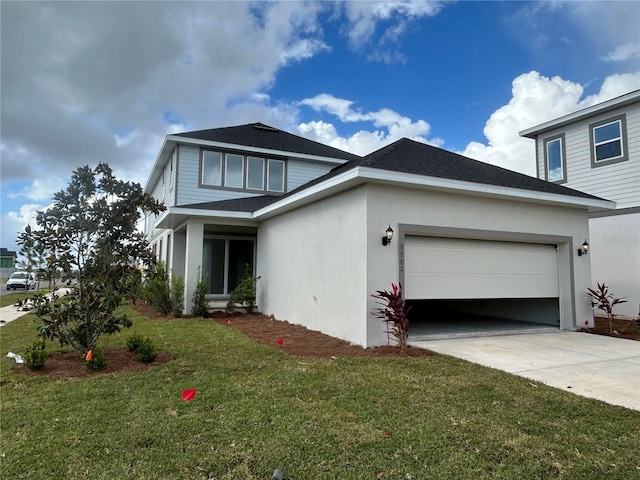 view of front of house with a garage and a front yard