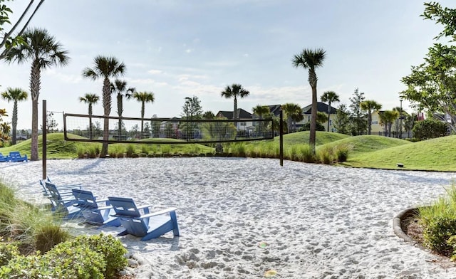 view of community featuring a yard and volleyball court