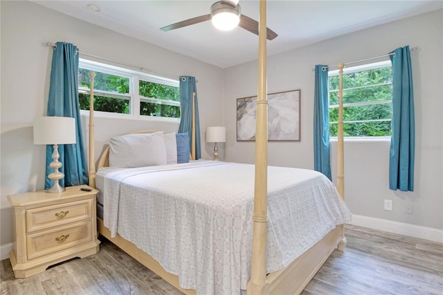 bedroom featuring light wood-type flooring and ceiling fan