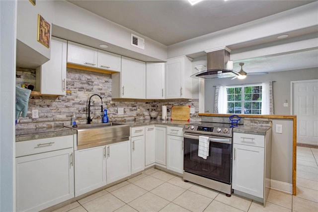 kitchen featuring island range hood, white cabinets, electric range, and ceiling fan