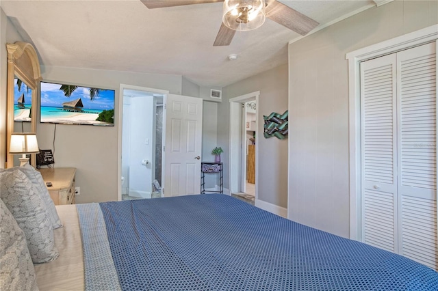 bedroom with ceiling fan, a closet, and lofted ceiling