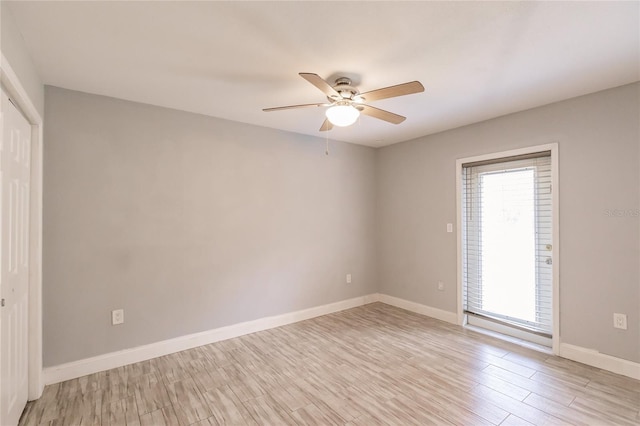 unfurnished room with ceiling fan and light hardwood / wood-style flooring