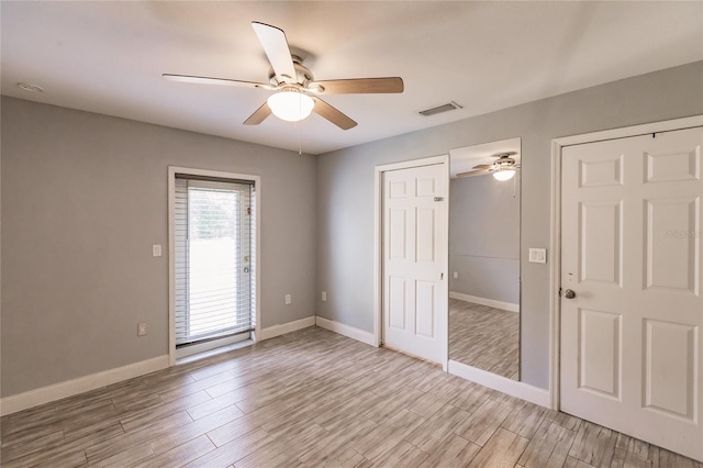 unfurnished room with light hardwood / wood-style floors and ceiling fan