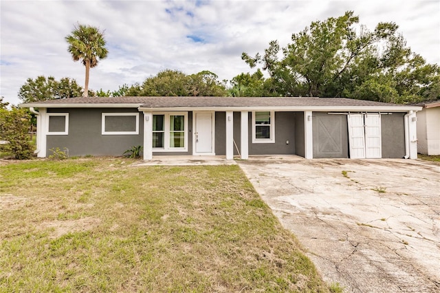 ranch-style house with stucco siding and a front yard