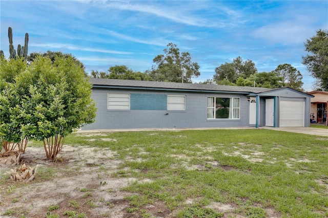 ranch-style house with a garage and a front lawn